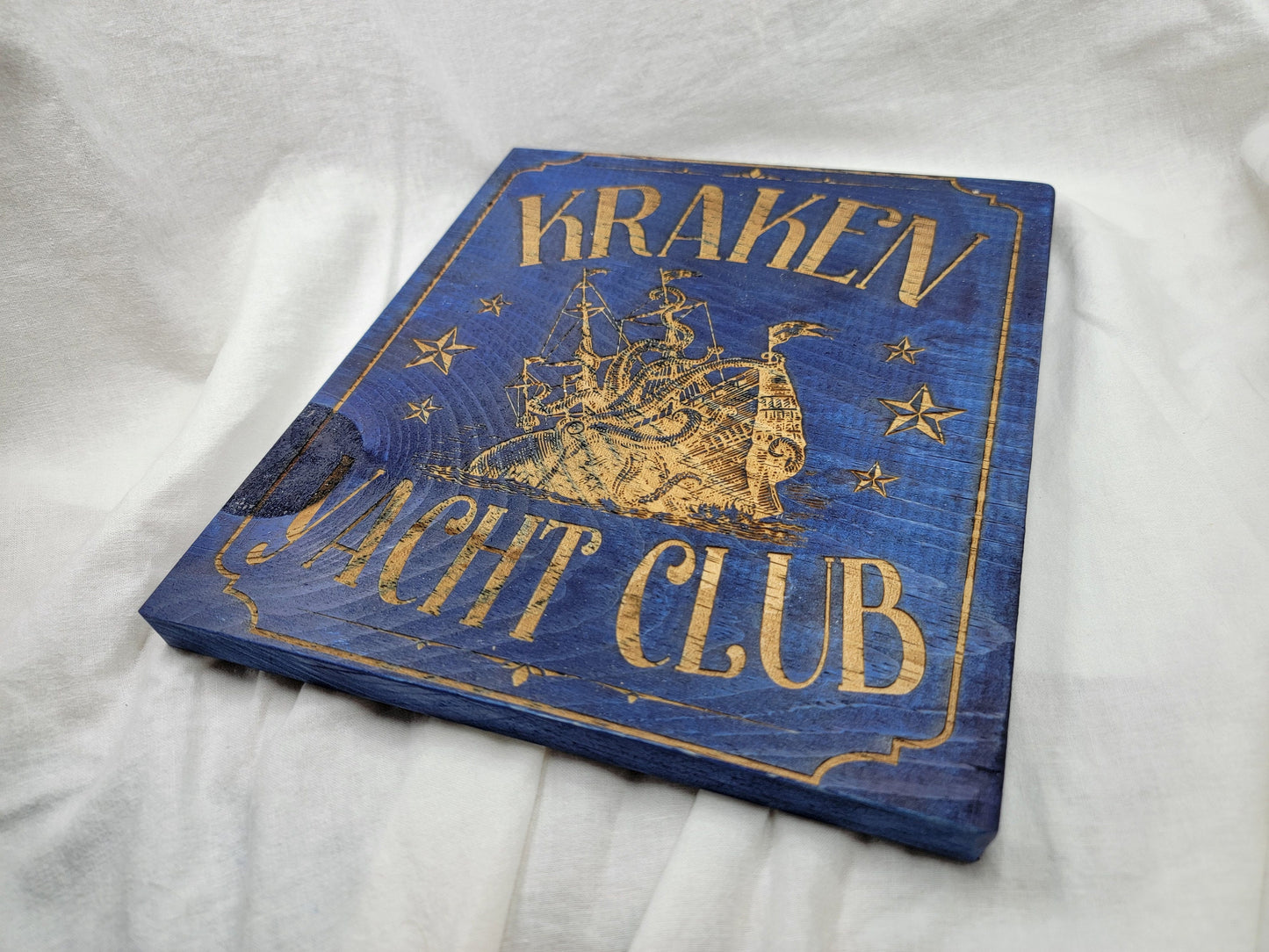 KRAKEN YACHT CLUB blue stained solid wood wall & shelf decor inspired by Scandinavian folklore display this nautical themed plaque proudly